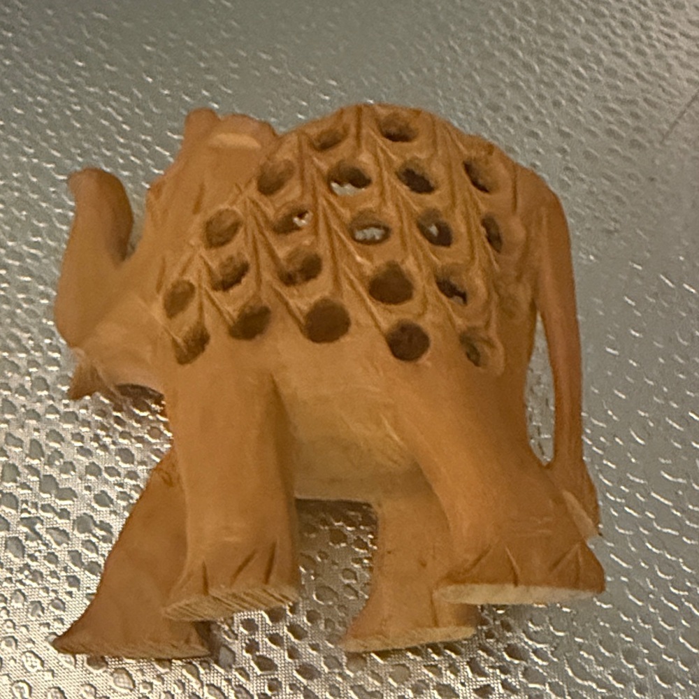 Hand-Carved Wooden Elephant Figurine in Warm Brown with a carved wooden baby